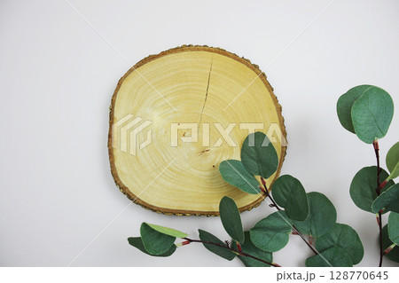 wooden podium product display stands flat lay with leaves top view on pink background wooden podium product display stands flat lay with leaves top view on pink background 128770645