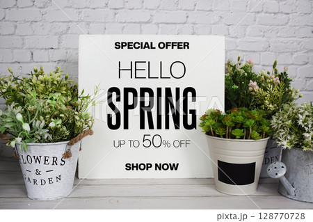Hello Spring Sale 50% off Promotion Offer Discount Retail Shopping Concept 128770728