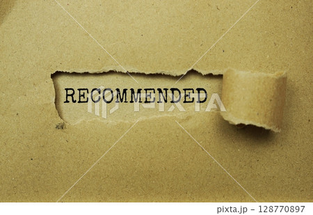 Recommended message written on craft paper with torn paper background Recommended message written on craft paper with torn paper background 128770897