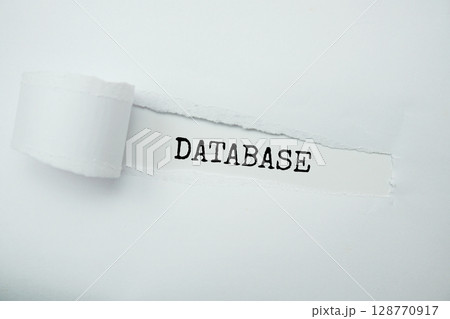 Database message written on white paper with torn paper background Database message written on white paper with torn paper background 128770917