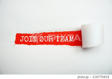 Join Our Team message written on red paper with torn paper background 128770928