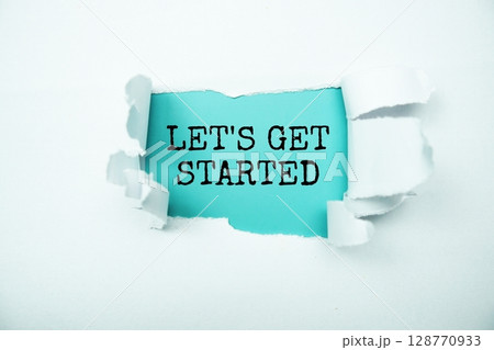 Let's Get Started message written on blue paper with torn paper background 128770933