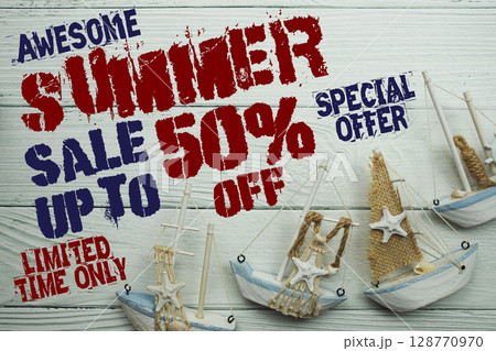 Summer Sale 50% off with Nautical and summer decoration on wooden background Summer Sale 50% off with Nautical and summer decoration on wooden background 128770970