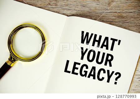 What's Your Legacy? text written on chalkboard with alarm clock on wooden background 128770993