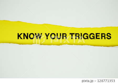Know Your Triggers text on yellow with white paper torn ripped of horizontal Know Your Triggers text on yellow with white paper torn ripped of horizontal 128771353