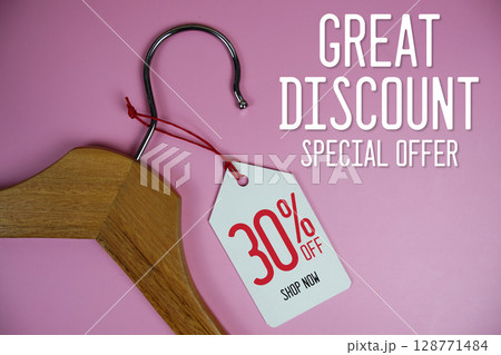 Great Discount Sale 30% off price tag label with Clothes hanger Clothing Promotion shopping concept 128771484