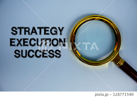 Strategy Execution Success text with magnifying glass on blue background Strategy Execution Success text with magnifying glass on blue background 128771590
