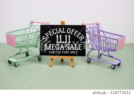11.11 Mega Sale Special Offer text with mini trolley shopping cart on green background 11.11 Mega Sale Special Offer text with mini trolley shopping cart on green background 128771612