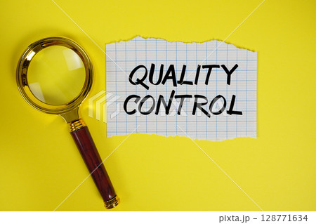 Quality Control text written on paper with magnifying glass 128771634