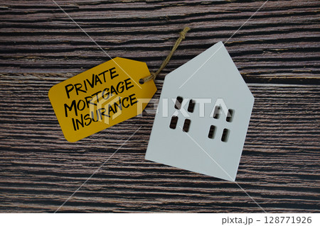 Private Mortgage Insurance text on price tag with white house model flat lay on wooden background 128771926