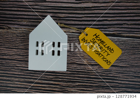 Home Equity Lines of Credit text on price tag with white house model flat lay on wooden background 128771934