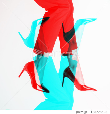 Woman with slim legs wearing high heel shoes and costume pants in RGB colors split effect Woman with slim legs wearing high heel shoes and costume pants in RGB colors split effect 128773528