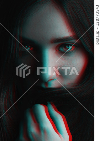 Beautiful woman futuristic portrait in RGB color channel split effect style Beautiful woman futuristic portrait in RGB color channel split effect style 128773543
