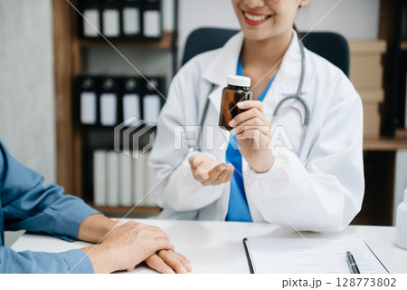Doctors explain the use of medication to patients. healthcare and medical concept. Doctors explain the use of medication to patients. healthcare and medical concept. 128773802