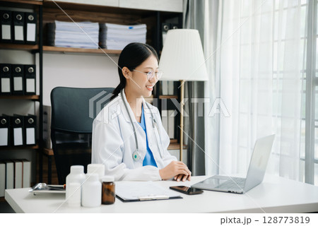 Medicine doctor hand working with modern digital tablet computer interface as medical network concept 128773819