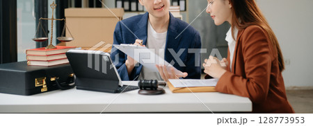 Business law concept, Lawyer business lawyers are consulting lawyers for women entrepreneurs to file copyright lawsuit with laptop and tablet at office Business law concept, Lawyer business lawyers are consulting lawyers for women entrepreneurs to file copyright lawsuit with laptop and tablet at office 128773953