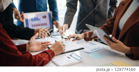 Business People Planning Strategy Analysis Office Concept. writing notes about sticky notes Laptop,tablet  Planning and Brainstorming Strategies in office 128774160