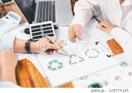 Business people working on sustainable innovation project. renewable energy concept. Teamwork Meeting, partner on model building company office technology, based green businesses and global warming. 128775145