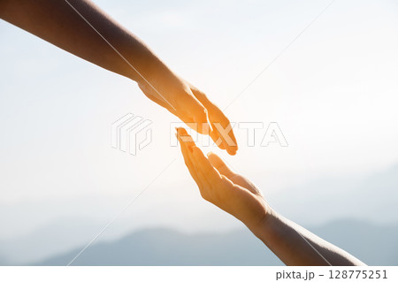 Young woman hand reaching for mountains. Spiritual girl smiling to sky. Happy female being thankful. Spiritual girl praying with hope. Positive asian young woman feeling hope and faith looking up. Young woman hand reaching for mountains. Spiritual girl smiling to sky. Happy female being thankful. Spiritual girl praying with hope. Positive asian young woman feeling hope and faith looking up. 128775251