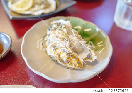 grilled Oyster in Matsushima fish market, seafood famous and popular of Matsushima bay in Miyagi Prefecture, Tohoku, Japan grilled Oyster in Matsushima fish market, seafood famous and popular of Matsushima bay in Miyagi Prefecture, Tohoku, Japan 128775638
