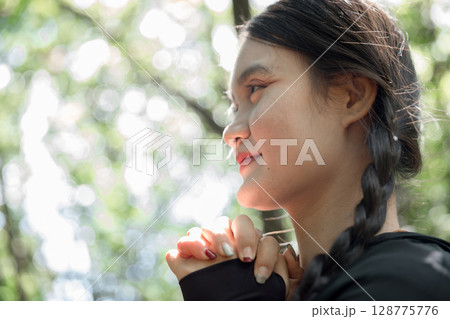 Grateful woman having HOPE praying to God. Spiritual girl smiling to sky. Happy female being thankful. Spiritual girl praying with hope. Positive asian young woman feeling hope and faith looking up. Grateful woman having HOPE praying to God. Spiritual girl smiling to sky. Happy female being thankful. Spiritual girl praying with hope. Positive asian young woman feeling hope and faith looking up. 128775776