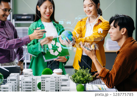 Group of diverse multiethnic businesspeople standing neare table looking at model of building from residential project. Green business company Group of diverse multiethnic businesspeople standing neare table looking at model of building from residential project. Green business company 128775785