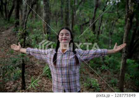 Grateful woman having HOPE praying to God. Spiritual girl smiling to sky. Happy female being thankful. Spiritual girl praying with hope. Positive asian young woman feeling hope and faith looking up. 128775849