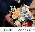 Beautiful wedding bouquet close-up in hands. 128775927