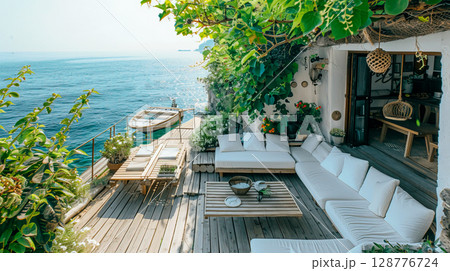 A tranquil coastal terrace adorned with greenery offers stunning ocean views, perfect for relaxation and serene moments. 128776724