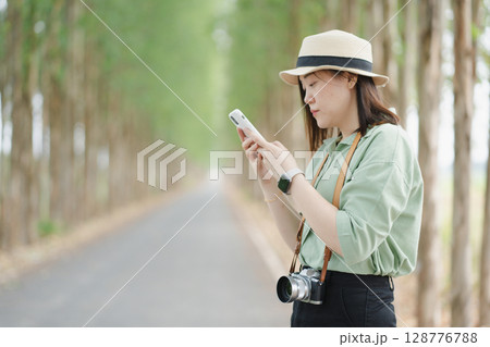 asian woman use phone check map during travel and relax at outdoor on spring season asian woman use phone check map during travel and relax at outdoor on spring season 128776788
