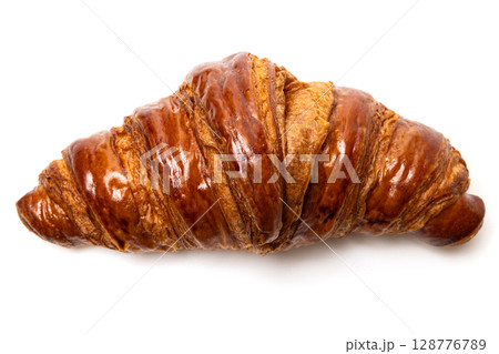 Freshly baked classic delicious fresh organic croissant isolated on white background Freshly baked classic delicious fresh organic croissant isolated on white background 128776789