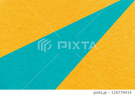 Abstract old yellow paper background with geometric turquoise rays, macro texture for banner, template, presentation Abstract old yellow paper background with geometric turquoise rays, macro texture for banner, template, presentation 128779414