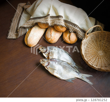 Bread and fish on the table 128781252