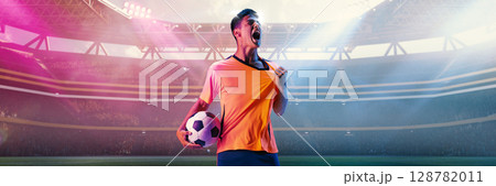 Male football player screaming with passion while holding ball in 3D stadium spotlight Male football player screaming with passion while holding ball in 3D stadium spotlight 128782011