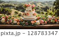 a wedding cake displayed on a rustic wooden table, surrounded by fresh flowers and greenery 128783347