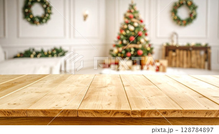 Festive Christmas tree and fireplace in a cozy room with holiday decorations and gifts 128784897