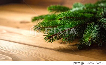 Christmas tree decoration on rustic wooden background, a festive evergreen branch for winter holiday celebration 128785242