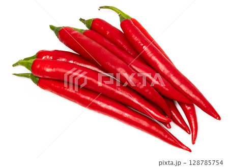 Bunch of red natural organic chili pepper pods isolated on white background Bunch of red natural organic chili pepper pods isolated on white background 128785754