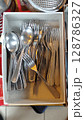 Silverware collection nestled in a box showcasing the beauty of everyday dining tools during a sunlit afternoon 128786327