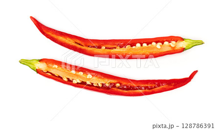 Sliced pods of red natural organic chili pepper on white background 128786391