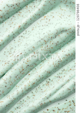 The texture of a mint body scrub with particles. Close-up The texture of a mint body scrub with particles. Close-up 128786408