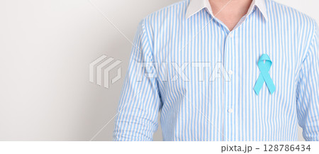 Man with blue Ribbon for concept of blue November, November Prostate Cancer Awareness month, World Diabetes day , Men Health month, International men, Father day. Healthcare and world cancer day 128786434