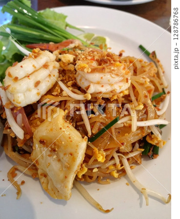 Pad thai in a bowl on the table Thai food 128786768