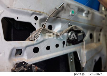 Hands Engaged in the Process of Performing Automotive Interior Repairs Effectively 128788246