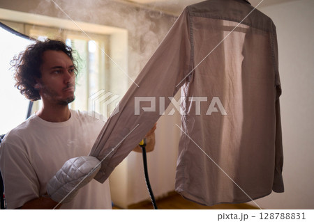 Using a Steam Iron expertly irons a shirt for a flawless, wrinkle free, polished look 128788831