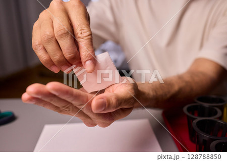 Hands Skillfully Managing Hydroponic Growing Medium with Exact Precise Careful Techniques 128788850