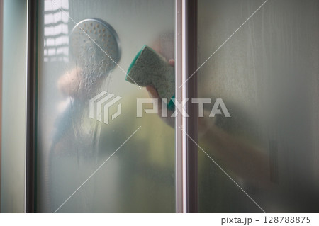 Cleaning the Shower A Glimpse Behind the Steam and the Importance of Hygiene and Care 128788875