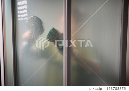 Cleaning the Shower A Glimpse Behind the Steam and the Importance of Hygiene and Care 128788876