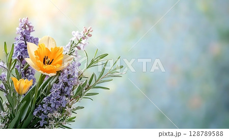 Vibrant Spring Bouquet with Yellow Tulip and Purple Flowers Against Soft Background 128789588