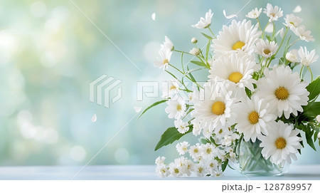 Fresh White Daisies in a Clear Vase on a Soft Focus Background for Floral Decoration 128789957